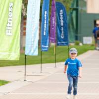 Child playing on course near finish line